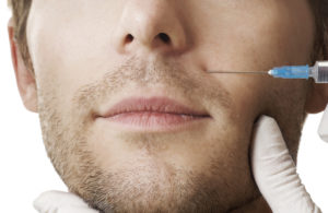 Man gets cosmetic injection of botox .Beauty Treatment Ladera Ranch